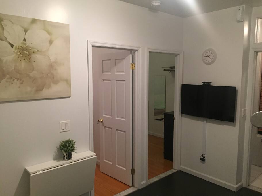 Living room with folded table (plant sitting on top)