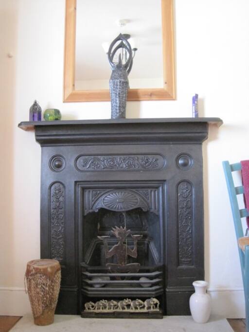 Unused cast iron fireplace in the second floor room