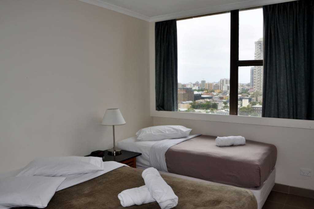 Bedroom 1 with 1 queen and 1 single beds