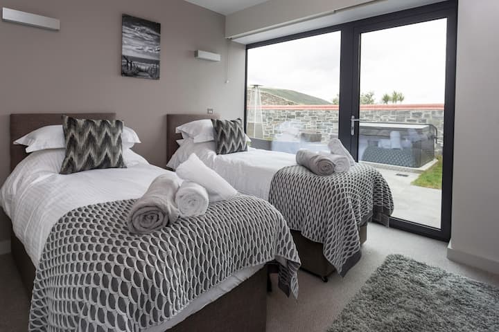 The twin room has access to the private terrace and the hot tub. (The twin beds can be made up into a king size bed upon request, prior to check in).