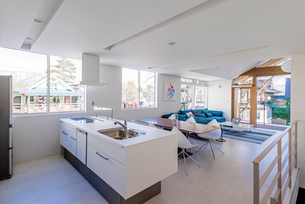 Open Kitchen, Dining + Living Room. Floor-to-Ceiling Windows in the living room. Side-A