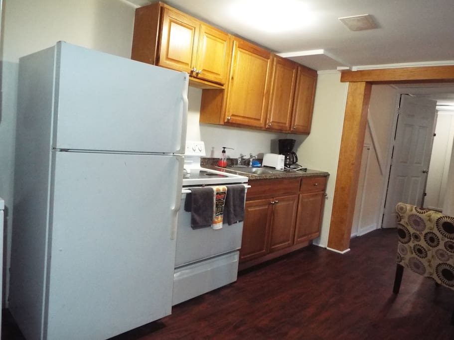 Kitchen area with full size appliances.