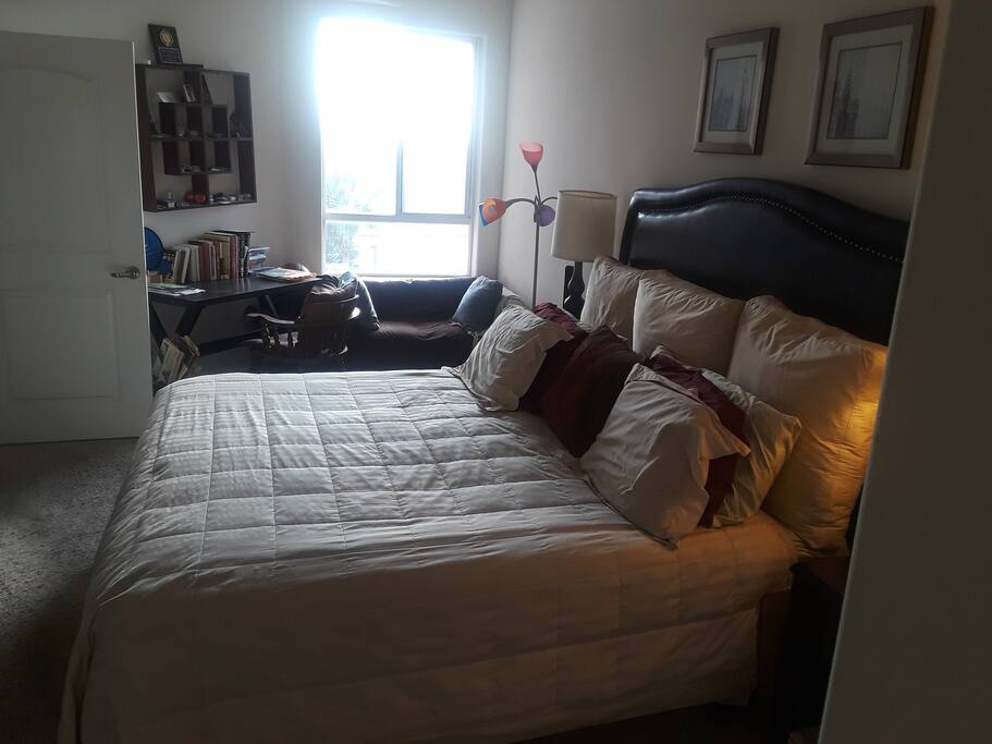Bedroom with desk and seating