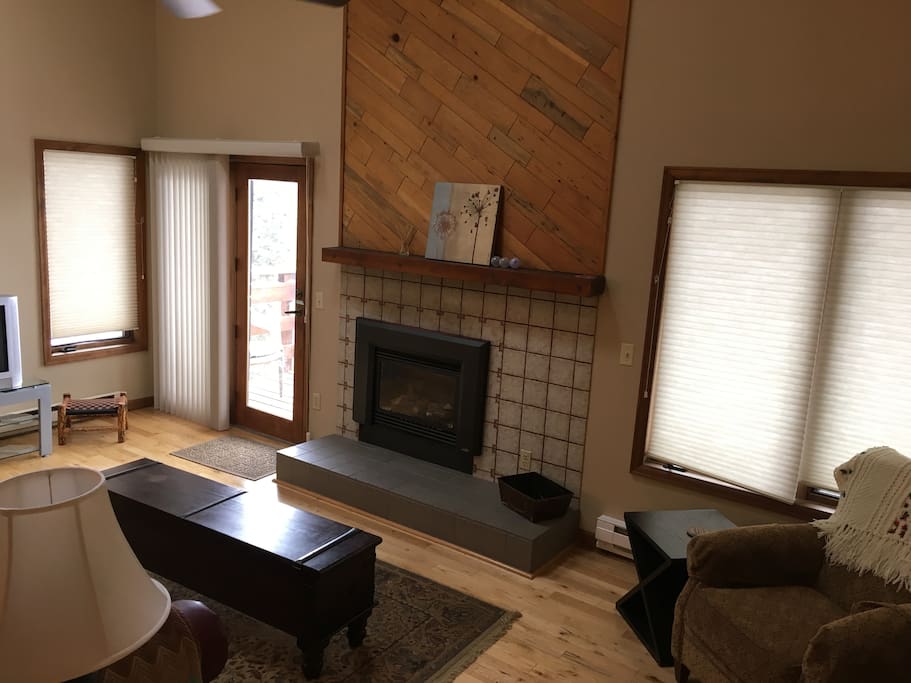 Living space with fire place and balcony