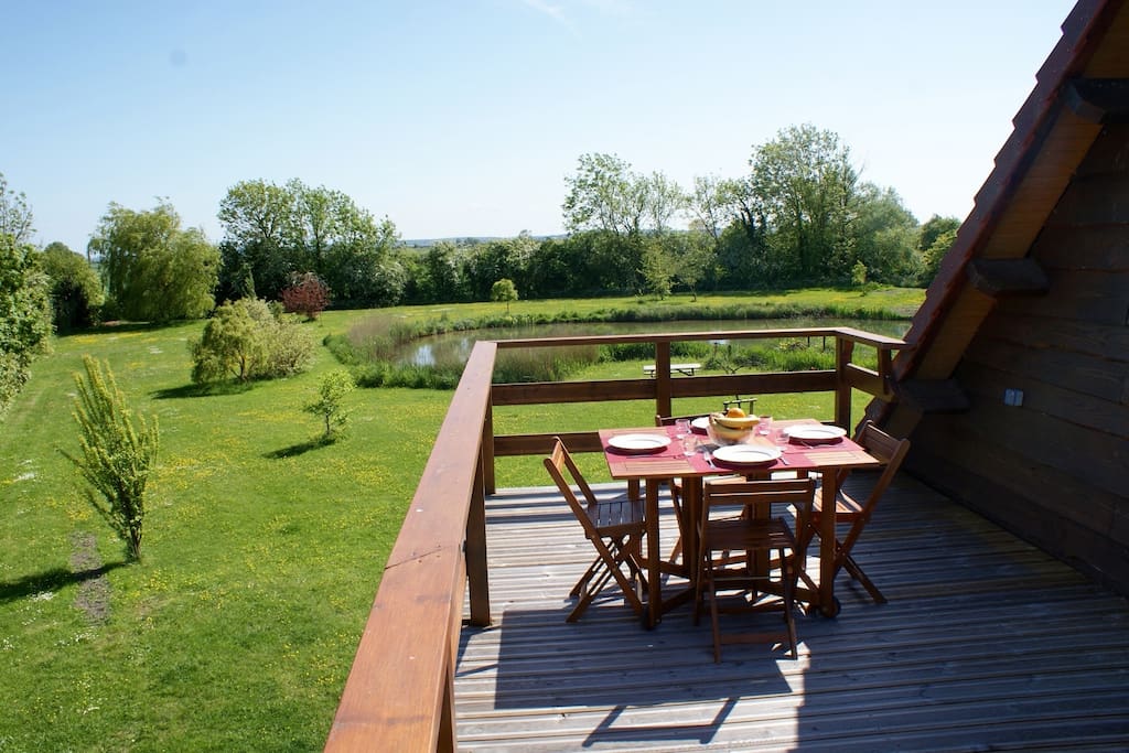 View of rear garden from the terrace. A great place for meals or just relax and enjoy the view!