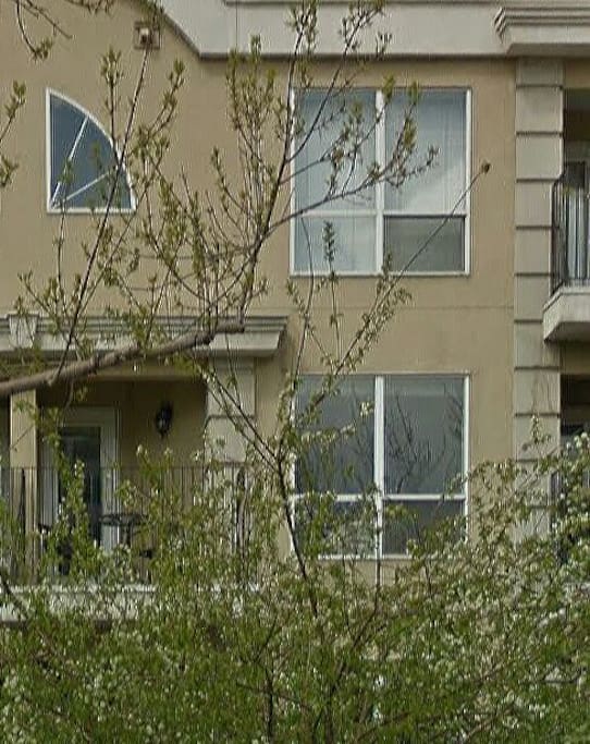It is a stacked townhouse. The unit is located on the upper two floors