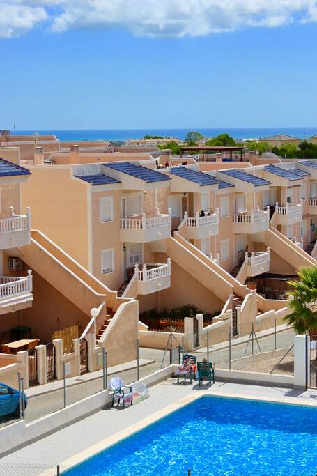 View of pool & coast from roof terrace