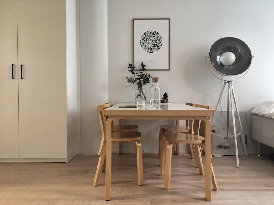 Artek table brings enough space to be comfortable for both eating and working.