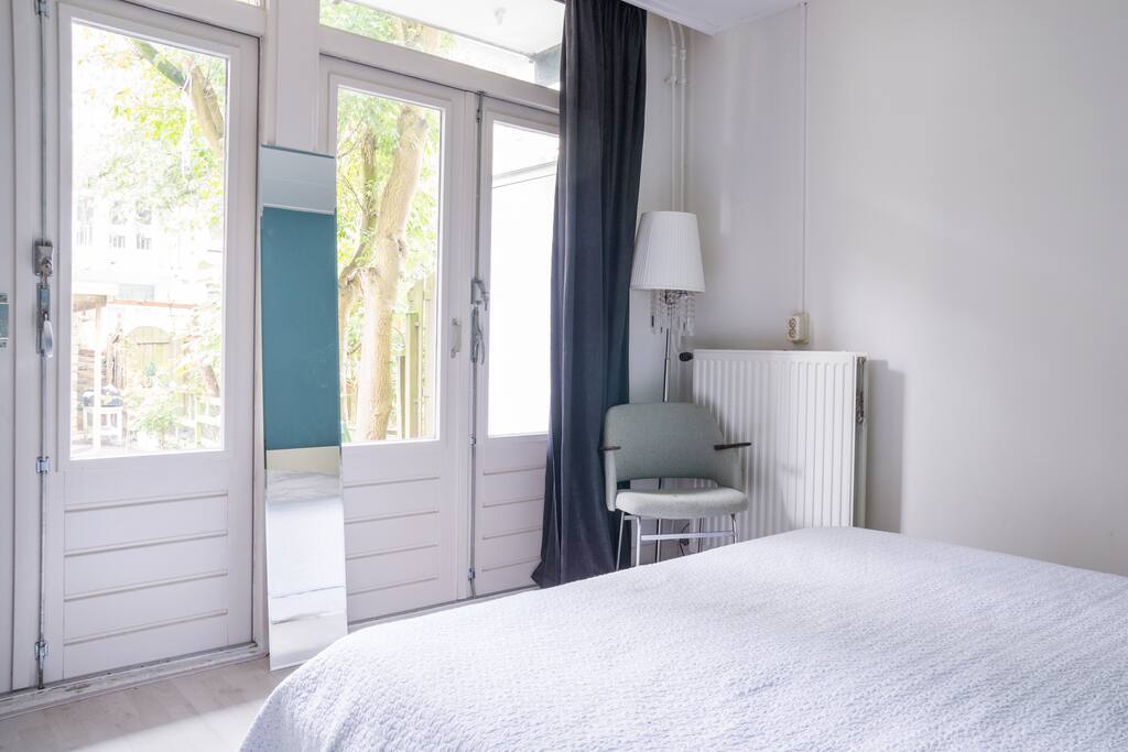 Comfortable bedroom with a big bed, overlooking the garden.
