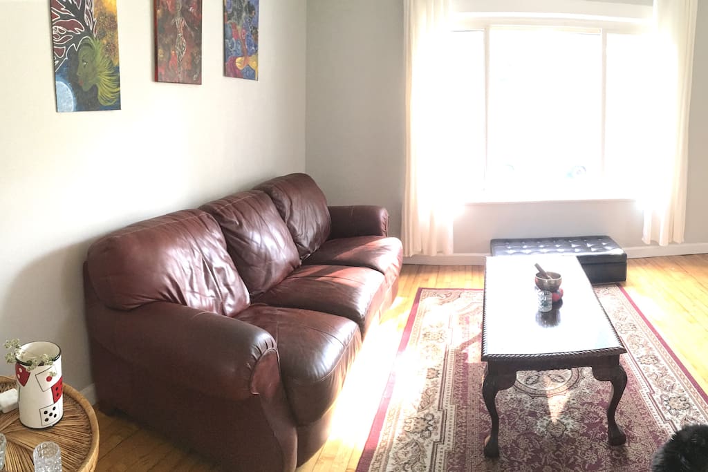 Walk into our living room. The huge windows makes this space a great spot to chill.