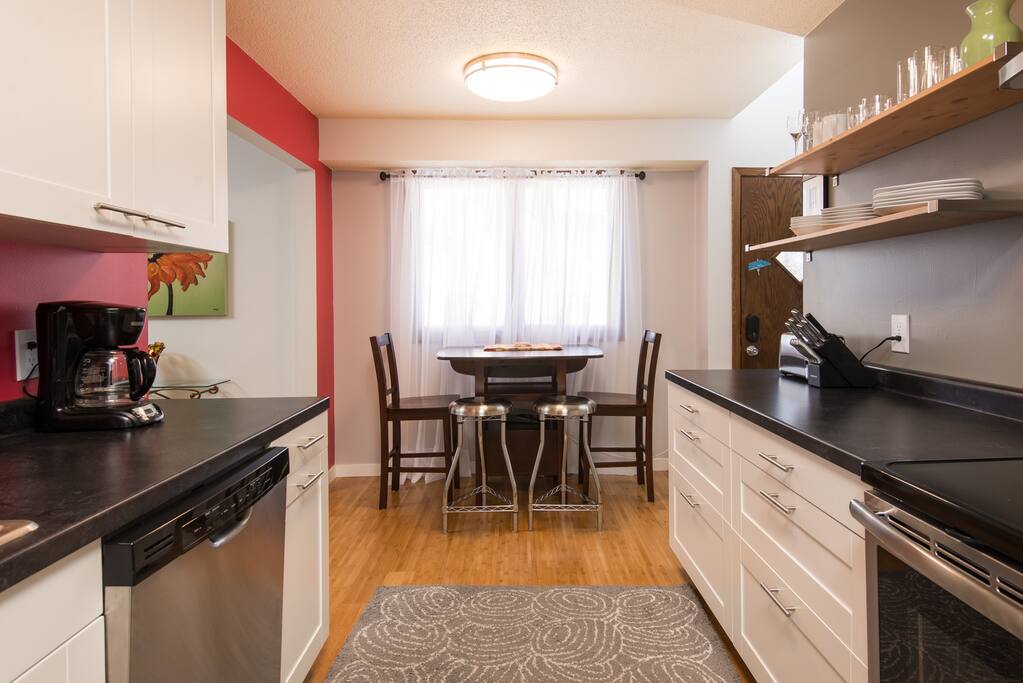 Dinette table seats four, or pull out table from the wall to flip up the extension to seat 6