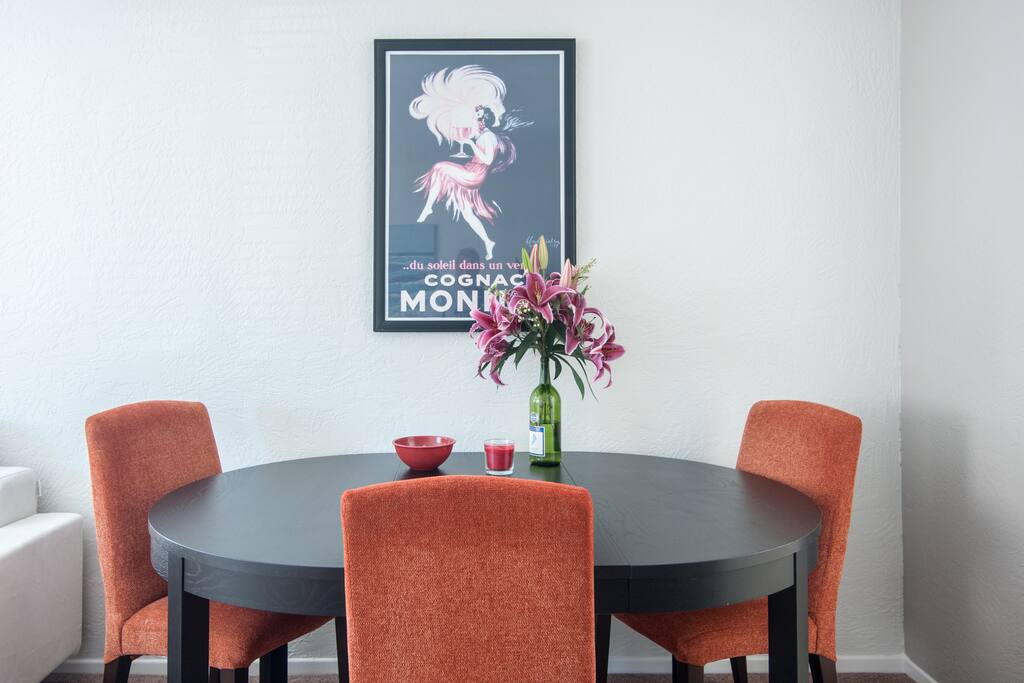 Dining table has extensions to seat 6 total