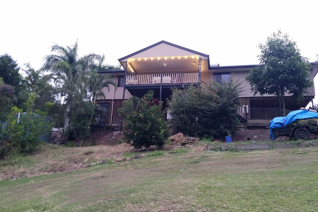 Looking up at our home from the grassy hill