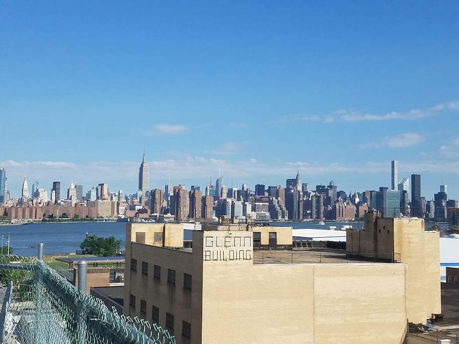 This is the daytime view of the NYC skyline. It is amazing at night, too. The roof is accessible at all hours. People may smoke up here.