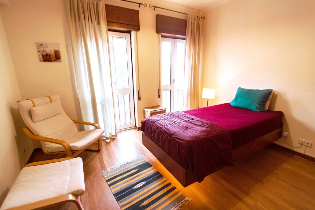 Bedroom with a floating single bed - notice the motion-sensor activated halo underneath it