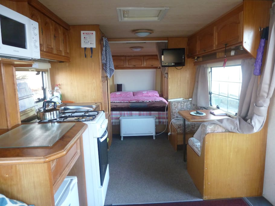 Double bed and kitchen