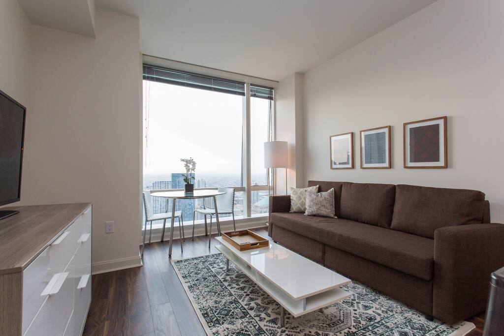 Living area with sleeper sofa, plenty of storage inside and also a large chest of drawers in living area