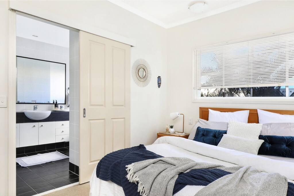 Queen size Bedroom with attached ensuite. Ceiling fans.