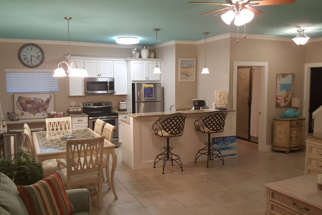 Open floor plan with beautifully painted ceilings that remind you of the beach!