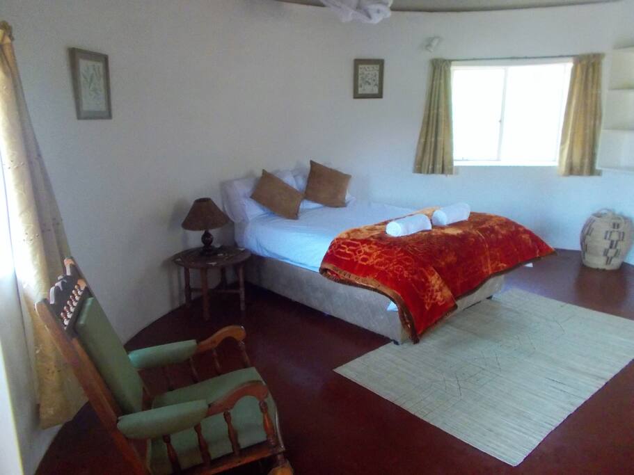 Front entrance leads into the main bedroom, (left)