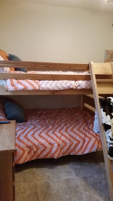 Full size bunks and TV in the 3rd quest bedroom.