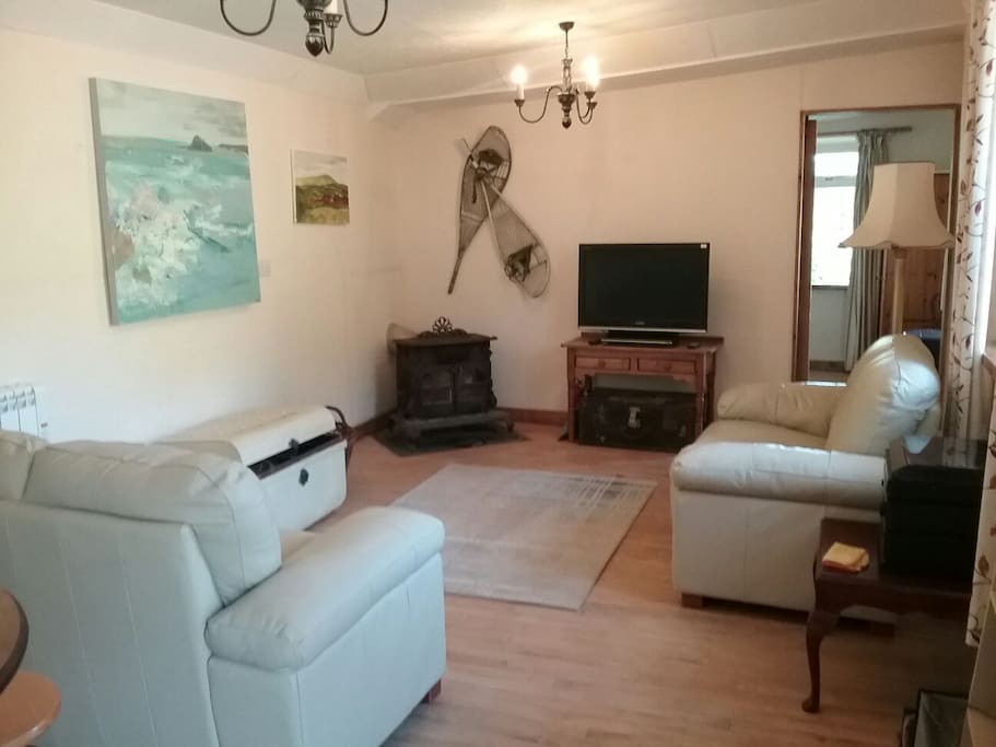 Spacious sitting room. Log burner , games chest and record player.