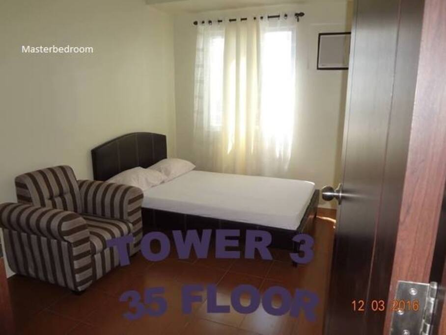 Master Bedroom with air condition, double bed, sofa and dresser