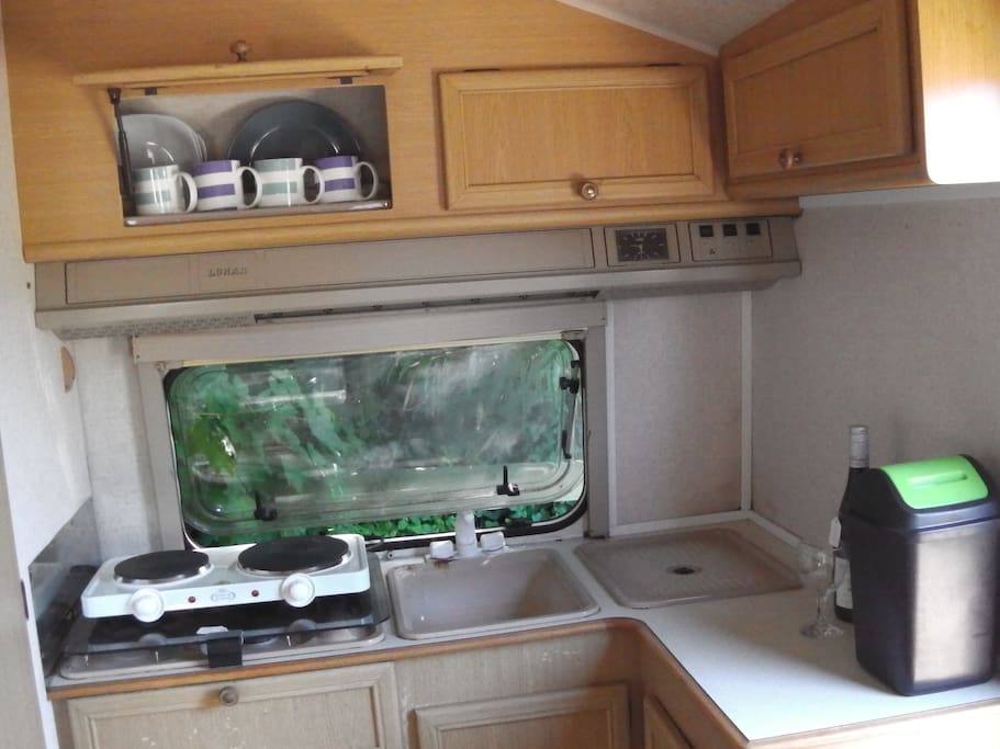 Kitchen area in Lunar, more cupboards with everything in them for your stay