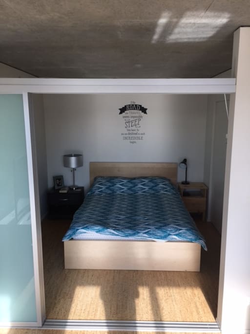 Comfortable queen bed with sliding partition