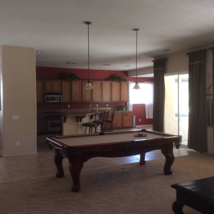 Pool table looking in to kitchen.