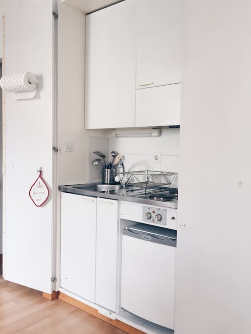 The complete kitchen is equipped with a full range of cooking tools, as well as two electrical stoves, a fridge and a sink.