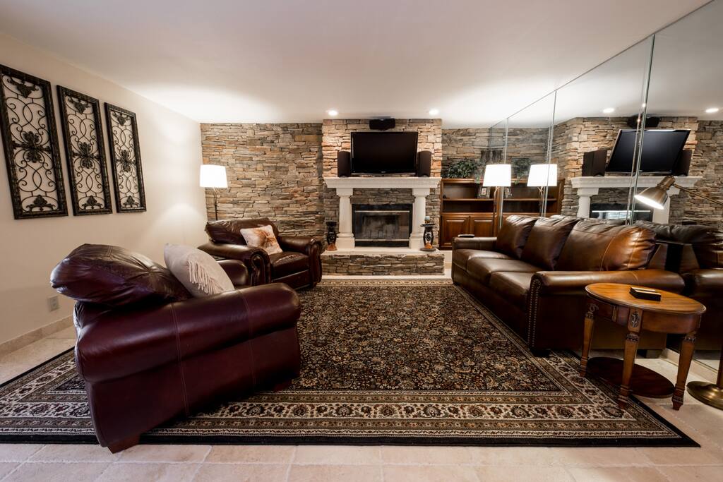 Family room off the kitchen with Surround sound, directv, and streaming services. The couch is a pull-out queen.