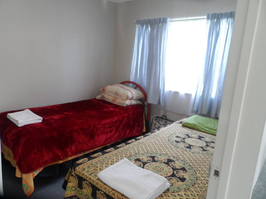 Second room with single beds. Storage cupboard included