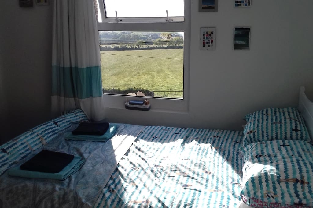 Lovely sunny bedroom with far reaching countryside views.