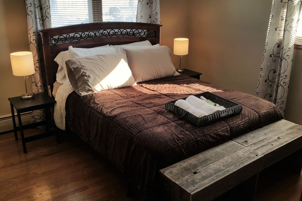 Comfortable Queen Bed integrated bedside lights and device charging