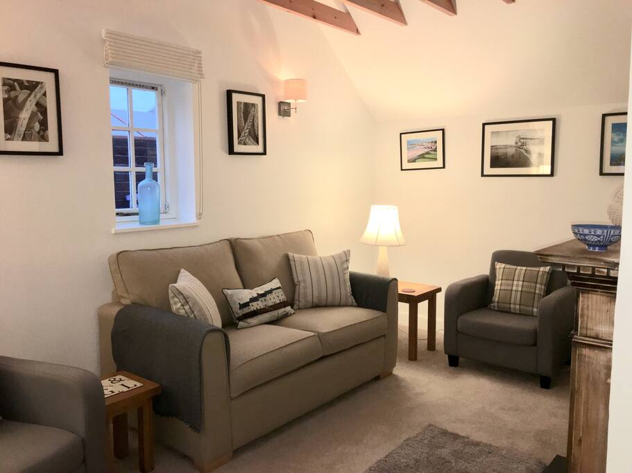 Sitting room with full height ceiling.