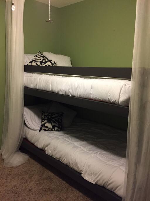 Second bedroom has twin bunk beds and a full size fold out bed
