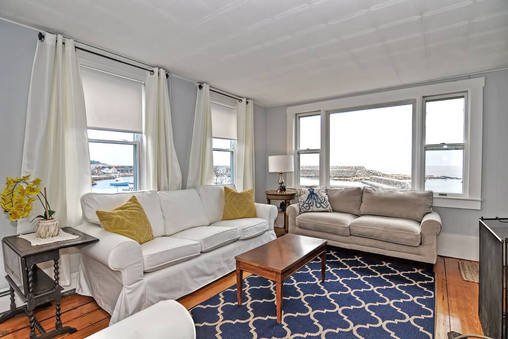 The Rockporter-The living room has lovely views of Pigeon Cove.