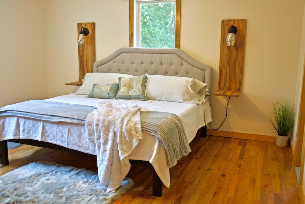 King-sized bed in master bedroom with new memory foam mattress.