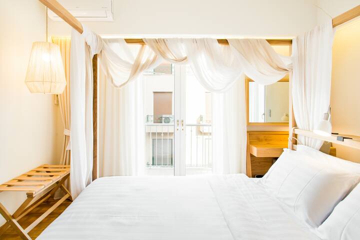 Powder-pink City Vistas from the Balcony at a Minimal Haven gallery image 2