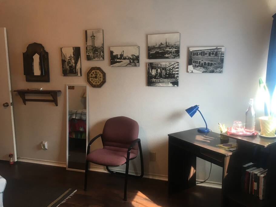 Lots of images and trinkets from abroad and small work space