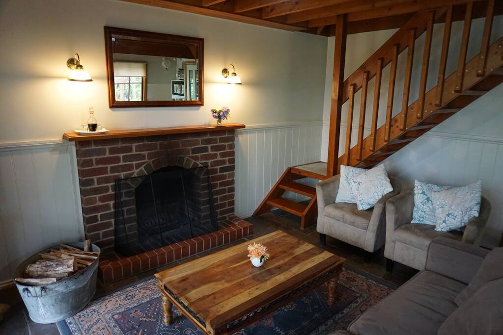 Living Room with open fireplace and wood supplied