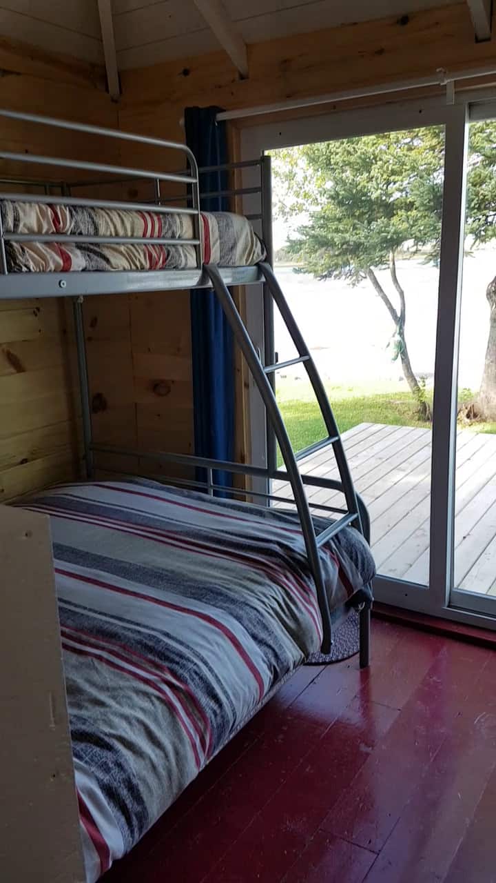 The second bedroom has a patio door leading to the deck and a fabulous view of the water.