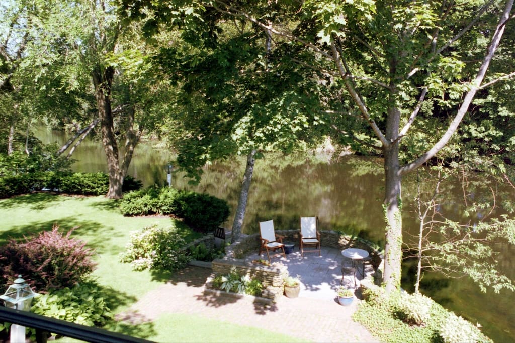 Outdoor seating area next to pond