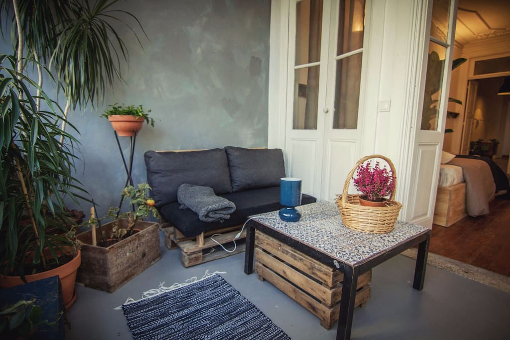 Cozy Veranda Winter Garden with Sofa and Coffee Table