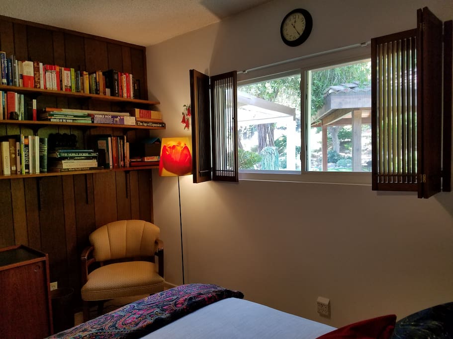 Enjoy reading, and private backyard view from your bedroom window.