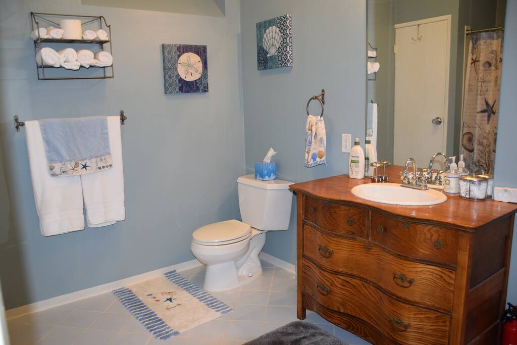 Large bathroom is stocked with everything you need during your stay - towels, toiletries (shampoo/conditioner/body wash/lotion), hair dryer, q-tips, cotton balls and makeup wipes. If you need anything else just ask!