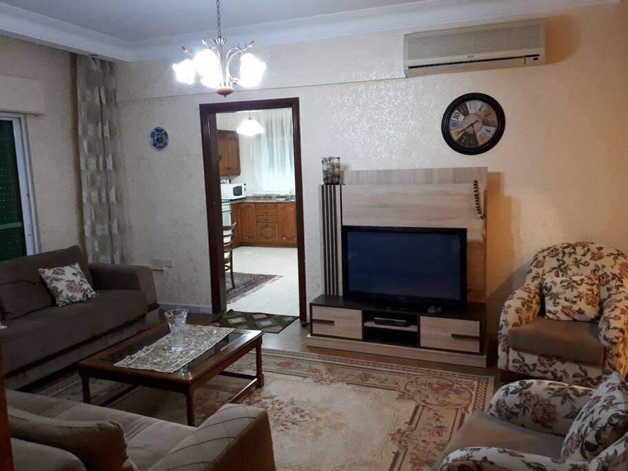 Main sitting/tv/family room with led tv and a powerful hot/cool air condition