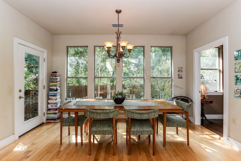 Dining area with windows to yard and door to deck