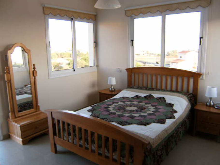 Second bedroom with sea view balcony, dressing mirror and ensuite bathroom.